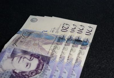 closeup-shot-of-four-twenty-euros-on-a-dark-gray-b-2023-11-27-04-50-43-utc-2