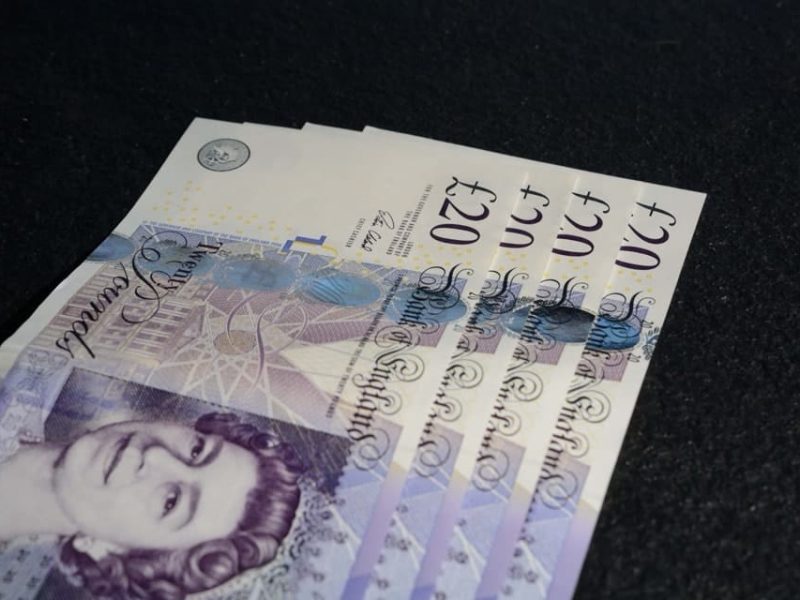 closeup-shot-of-four-twenty-euros-on-a-dark-gray-b-2023-11-27-04-50-43-utc-2